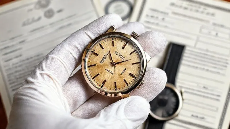 A photorealistic image of a vintage luxury watch with a subtly aged dial and case, held gently by a hand wearing white gloves, against a backdrop of official watch documentation and service papers. The lighting is soft and professional, highlighting the watch's character and the importance of provenance. 8K, sharp focus.